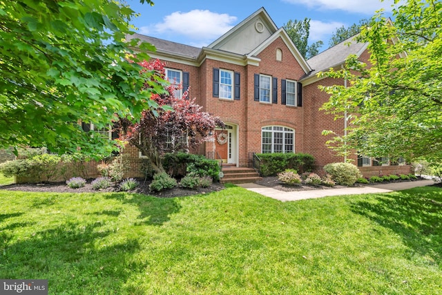 8220 Waterside Ct, Fort Washington, MD 20744 - colonial house with brick siding and a front yard