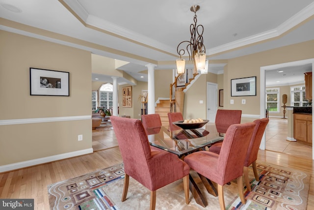 8220 Waterside Ct, Fort Washington, MD 20744 - dining area with decorative columns, ornamental molding, stairs, light wood finished floors, and healthy amount of natural light