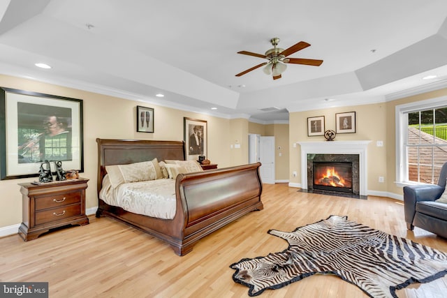 8220 Waterside Ct, Fort Washington, MD 20744 - bedroom with a tray ceiling, wood finished floors, crown molding, recessed lighting, and a premium fireplace