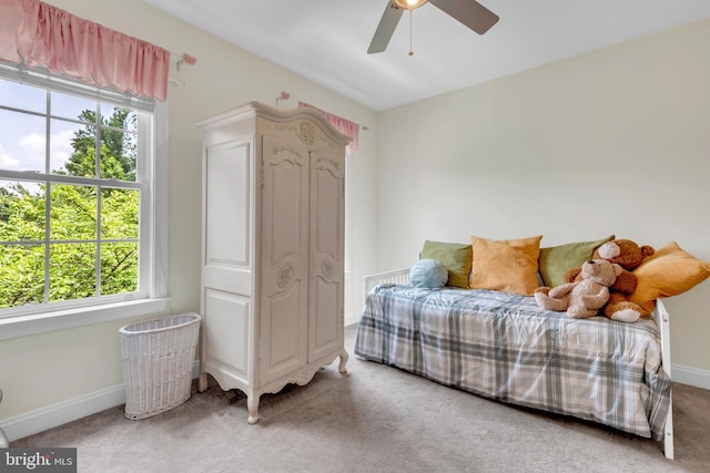 8220 Waterside Ct, Fort Washington, MD 20744 - bedroom with multiple windows, carpet floors, baseboards, and a ceiling fan