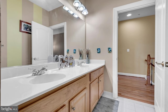 8220 Waterside Ct, Fort Washington, MD 20744 - bathroom with double vanity, tile patterned floors, and baseboards