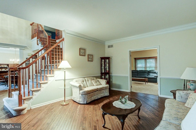 235 Amherst Dr, Doylestown, PA 18901 - living room featuring stairs, wood finished floors, crown molding, a chandelier, and baseboards