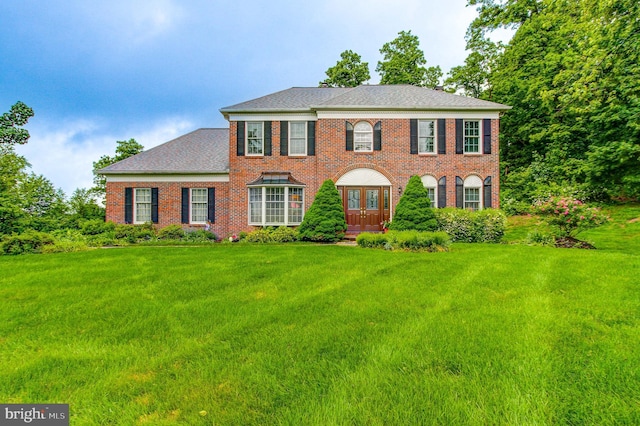 235 Amherst Dr, Doylestown, PA 18901 - view of front of home with a front lawn, brick siding, and roof with shingles