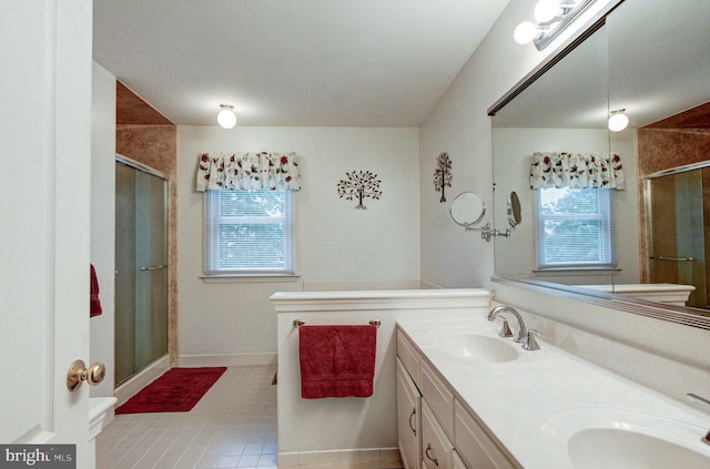 235 Amherst Dr, Doylestown, PA 18901 - full bathroom with a stall shower, double vanity, baseboards, and tile patterned floors