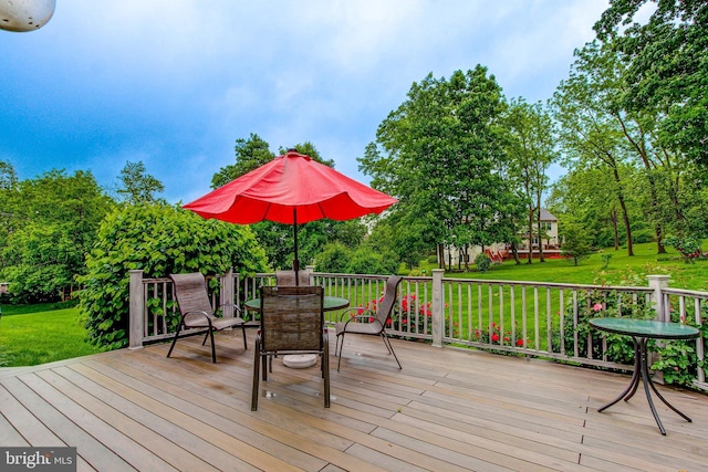 235 Amherst Dr, Doylestown, PA 18901 - wooden deck featuring outdoor dining space, a lawn, and view of wooded area