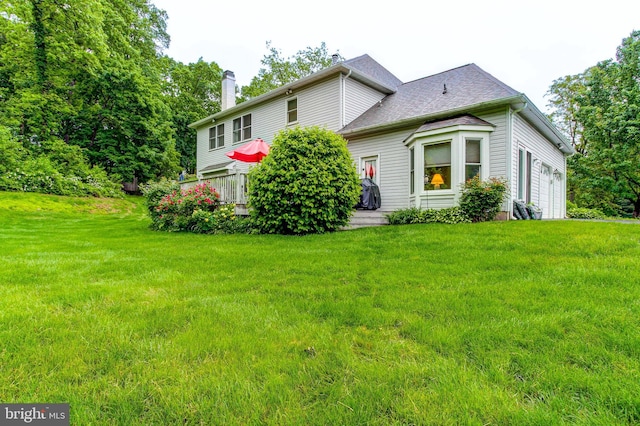 235 Amherst Dr, Doylestown, PA 18901 - view of front of house featuring a chimney, a front yard, and a shingled roof