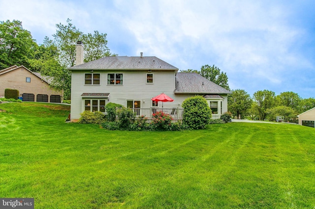 235 Amherst Dr, Doylestown, PA 18901 - rear view of property featuring a lawn, a chimney, and a deck
