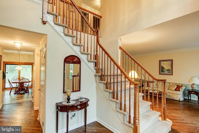 235 Amherst Dr, Doylestown, PA 18901 - stairs with wood finished floors, ornamental molding, baseboards, and a high ceiling