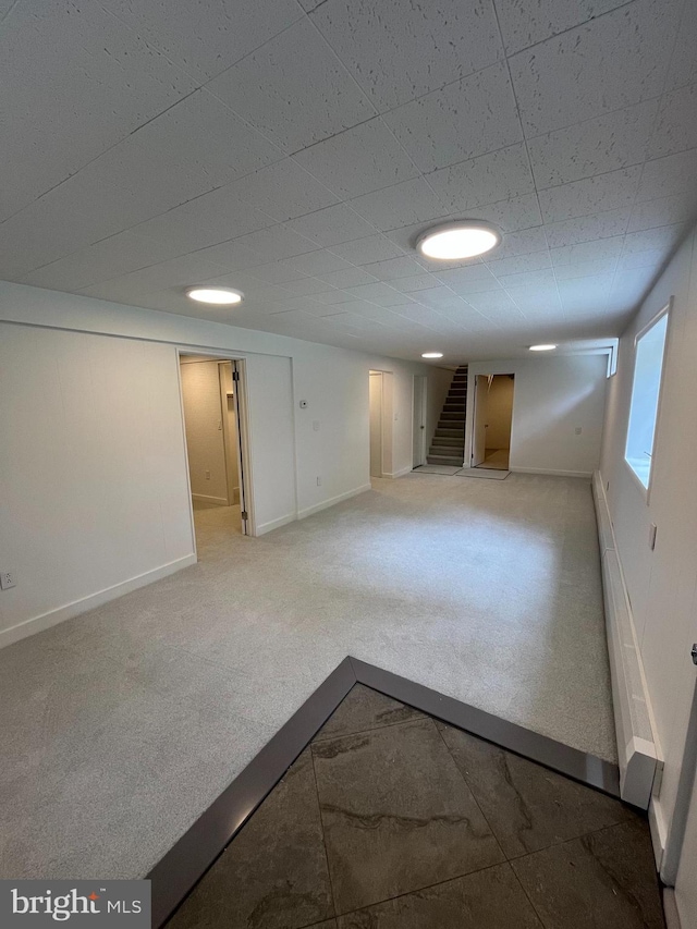 905 Dunellen Dr, Towson, MD 21286 - basement with stairs, baseboards, and carpet