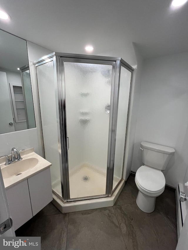 905 Dunellen Dr, Towson, MD 21286 - bathroom featuring vanity, toilet, a shower stall, and recessed lighting