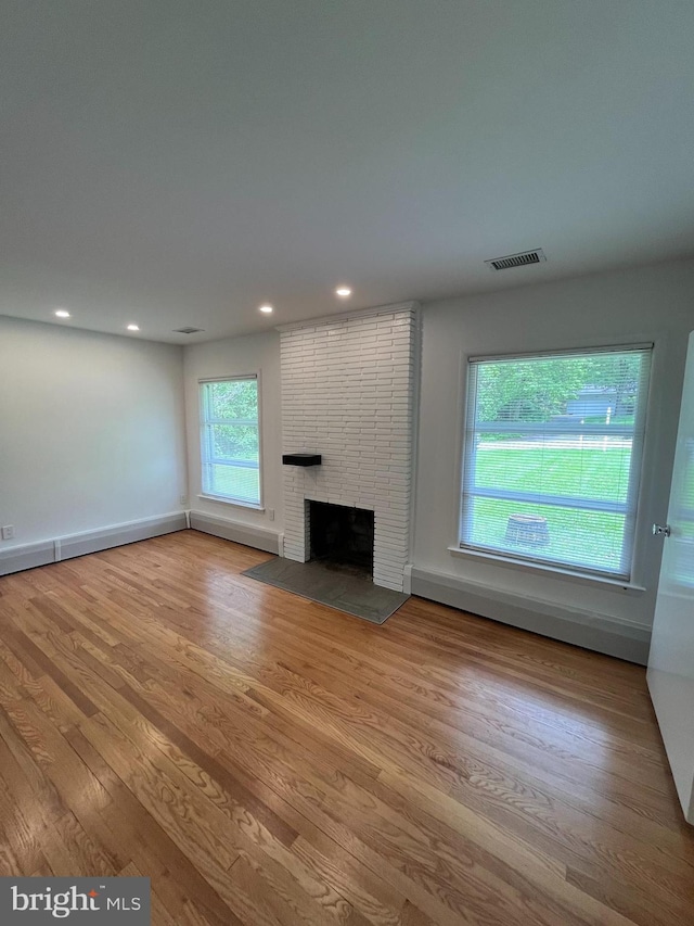 905 Dunellen Dr, Towson, MD 21286 - unfurnished living room featuring a fireplace, wood finished floors, recessed lighting, and baseboards