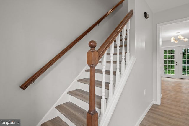 6127 Haymarket Way, Mechanicsburg, PA 17050 - stairway featuring wood finished floors, baseboards, french doors, and a chandelier