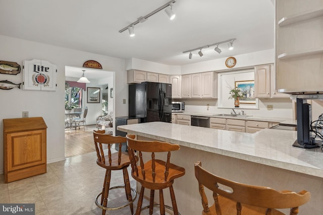 1316 Carpenters Point Rd, Perryville, MD 21903 - kitchen with stainless steel appliances, a peninsula, light countertops, a sink, and a kitchen bar