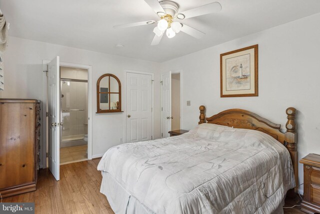 1316 Carpenters Point Rd, Perryville, MD 21903 - bedroom featuring wood finished floors, baseboards, ceiling fan, and connected bathroom