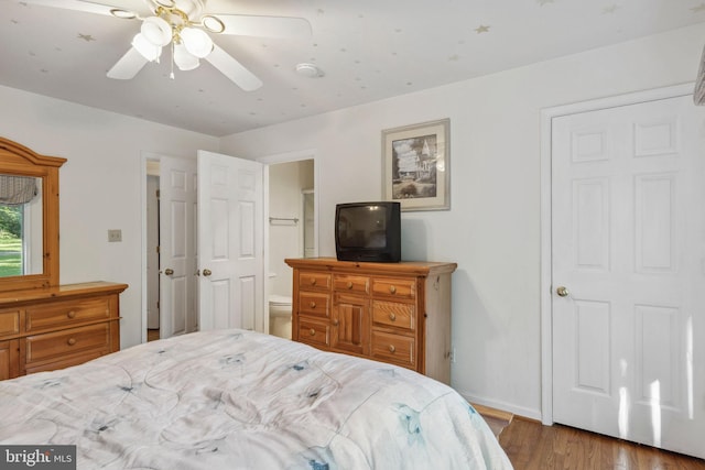 1316 Carpenters Point Rd, Perryville, MD 21903 - bedroom featuring wood finished floors, baseboards, ensuite bathroom, and ceiling fan