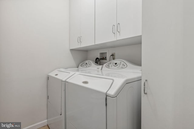 1316 Carpenters Point Rd, Perryville, MD 21903 - laundry room with washing machine and dryer, cabinet space, and baseboards