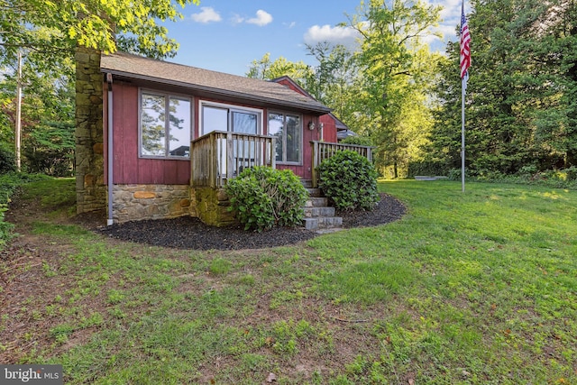 1316 Carpenters Point Rd, Perryville, MD 21903 - view of home's exterior with a wooden deck, a yard, and roof with shingles