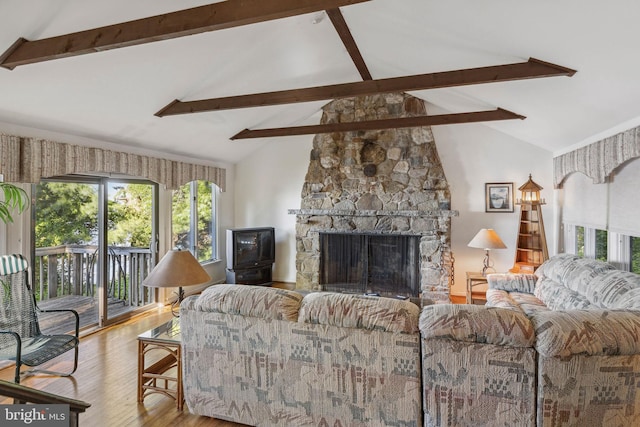 1316 Carpenters Point Rd, Perryville, MD 21903 - living room with beam ceiling, wood finished floors, a stone fireplace, and high vaulted ceiling