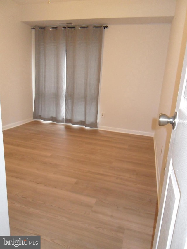 6087 Majors Ln Unit 1, Columbia, MD 21045 - unfurnished room with light wood finished floors and baseboards