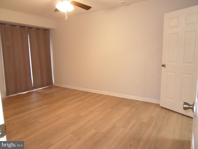 6087 Majors Ln Unit 1, Columbia, MD 21045 - unfurnished bedroom featuring light wood finished floors, baseboards, and a ceiling fan
