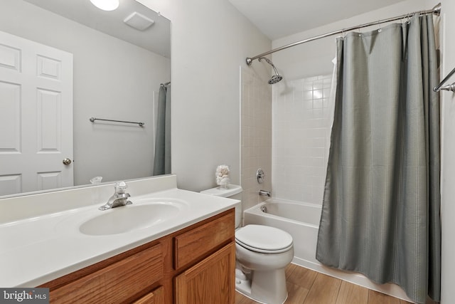 11438 Abner Ave, Fairfax, VA 22030 - bathroom featuring vanity, toilet, shower / bath combo, and wood finished floors