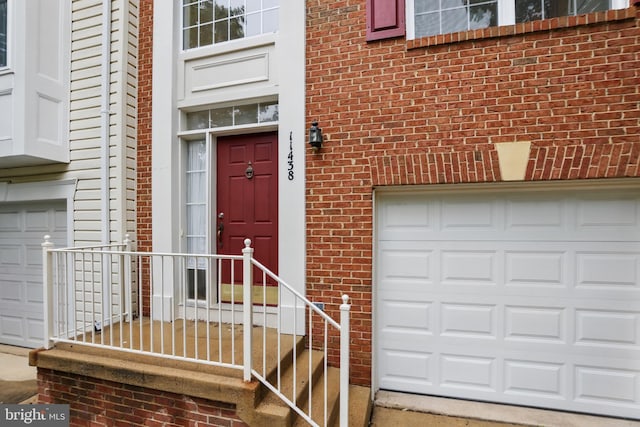 11438 Abner Ave, Fairfax, VA 22030 - doorway to property with brick siding and an attached garage