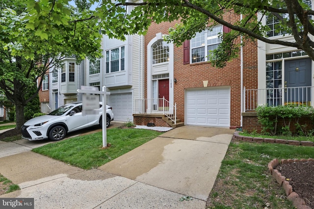11438 Abner Ave, Fairfax, VA 22030 - view of front of home with driveway, an attached garage, and brick siding