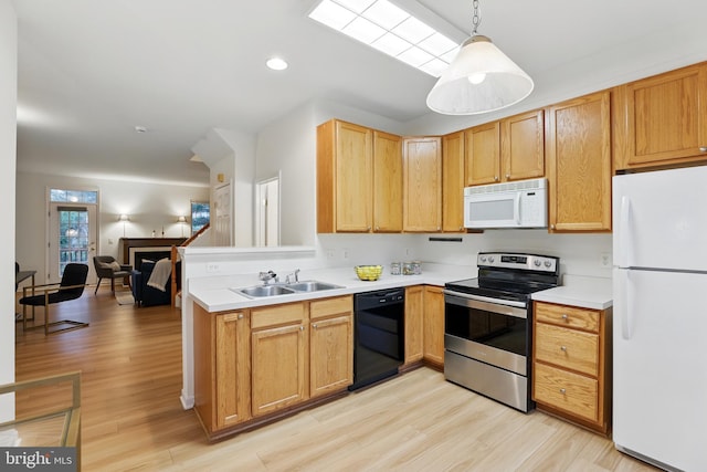 11438 Abner Ave, Fairfax, VA 22030 - kitchen featuring white appliances, a sink, light wood-style flooring, light countertops, and recessed lighting