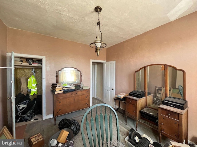 1744 Llewelyn Ave, Baltimore, MD 21213 - dining space featuring dark wood-style floors, a textured ceiling, and a textured wall