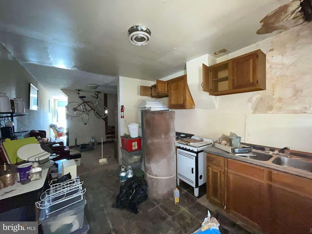 1744 Llewelyn Ave, Baltimore, MD 21213 - kitchen featuring brown cabinets and a sink