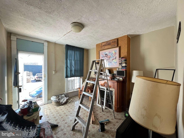 1744 Llewelyn Ave, Baltimore, MD 21213 - playroom with tile patterned floors and a textured ceiling