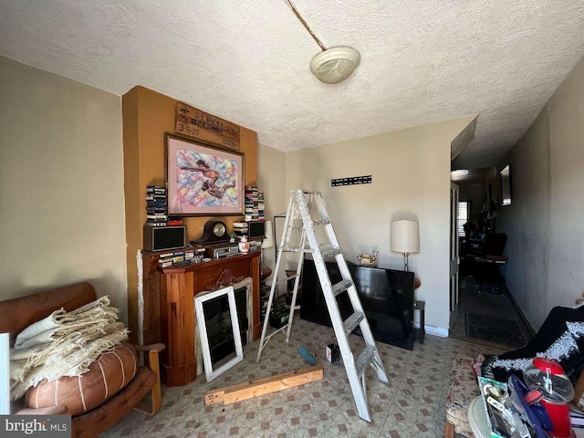 1744 Llewelyn Ave, Baltimore, MD 21213 - living room with a textured ceiling and tile patterned floors