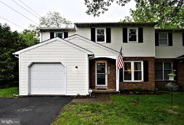 16 Grove Cir, Sellersville, PA 18960 - view of front of home featuring brick siding, a garage, driveway, and a front yard