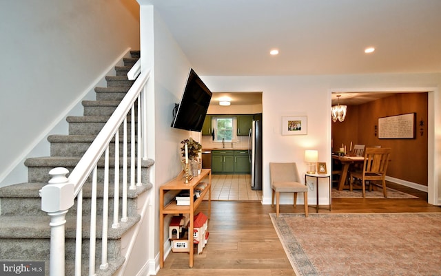 16 Grove Cir, Sellersville, PA 18960 - staircase featuring wood finished floors, a chandelier, recessed lighting, and baseboards