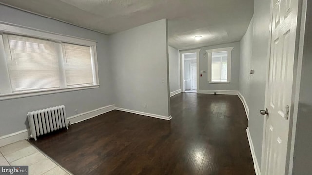 4937 N 13th St, Philadelphia, PA 19141 - spare room featuring radiator, baseboards, and wood finished floors