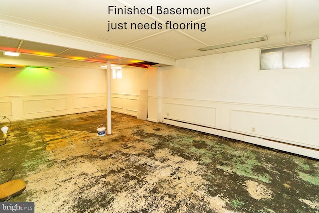 209 Berkshire Ave, Linwood, NJ 08221 - finished basement with a baseboard heating unit, a decorative wall, and a wainscoted wall