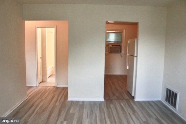 132 Lemmon Ave, Pemberton, NJ 08068 - unfurnished bedroom with freestanding refrigerator, wood finished floors, a walk in closet, and baseboards
