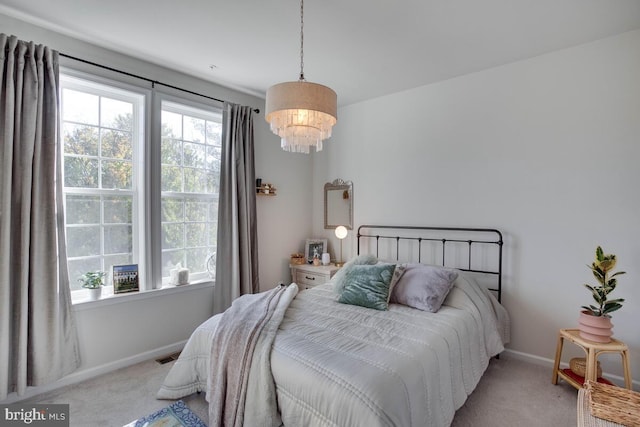 3402 Gentle Breeze Dr, Upper Marlboro, MD 20772 - bedroom with light carpet, baseboards, and a chandelier