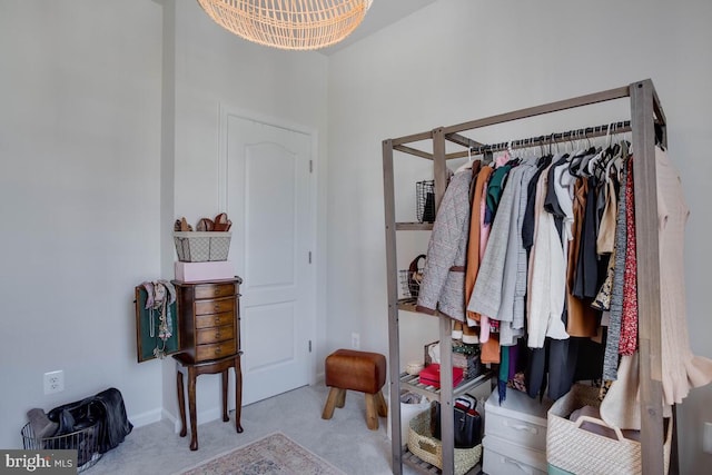 3402 Gentle Breeze Dr, Upper Marlboro, MD 20772 - walk in closet featuring carpet floors and a chandelier