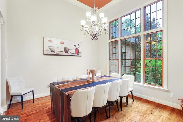 25 Mariner Ct, Ridgeley, WV 26753 - dining area with baseboards, a chandelier, crown molding, and light wood finished floors