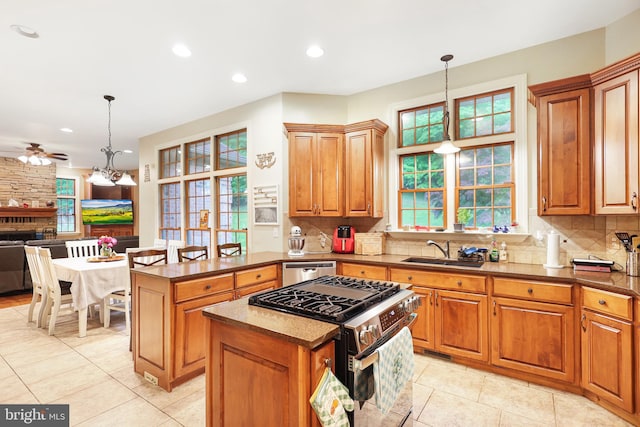 25 Mariner Ct, Ridgeley, WV 26753 - kitchen with stainless steel appliances, a sink, ceiling fan, light tile patterned floors, and backsplash