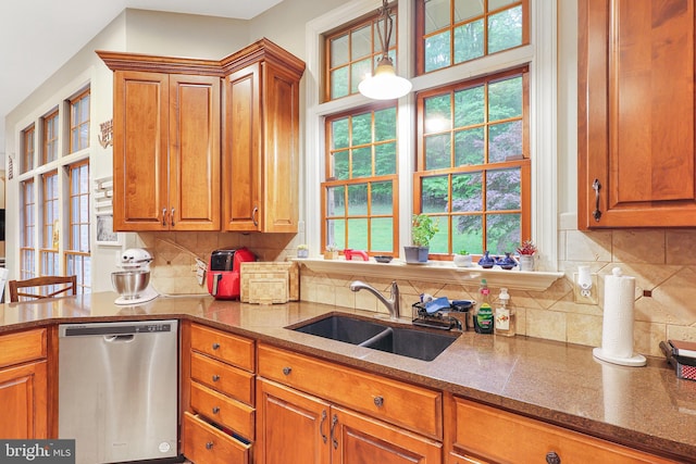 25 Mariner Ct, Ridgeley, WV 26753 - kitchen featuring stainless steel dishwasher, a sink, brown cabinets, and plenty of natural light