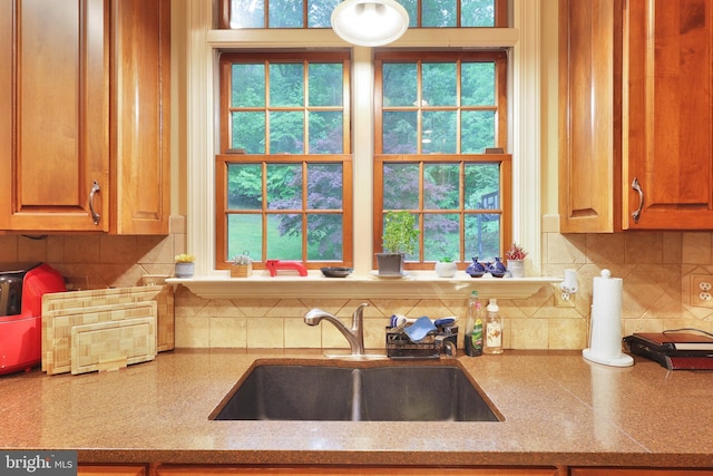 25 Mariner Ct, Ridgeley, WV 26753 - kitchen featuring a sink, decorative backsplash, and light stone counters