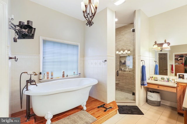 25 Mariner Ct, Ridgeley, WV 26753 - full bathroom with a stall shower, a freestanding tub, tile patterned flooring, wainscoting, and tile walls
