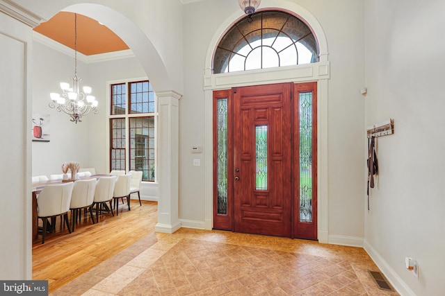 25 Mariner Ct, Ridgeley, WV 26753 - entrance foyer featuring plenty of natural light, a chandelier, arched walkways, baseboards, and a high ceiling