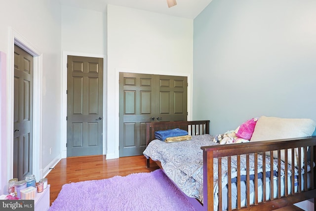 25 Mariner Ct, Ridgeley, WV 26753 - bedroom featuring wood finished floors, baseboards, and a towering ceiling