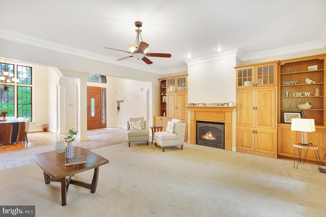 25 Mariner Ct, Ridgeley, WV 26753 - living area with crown molding, a lit fireplace, a ceiling fan, light tile patterned flooring, and baseboards