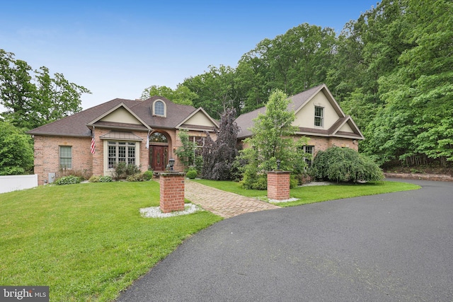 25 Mariner Ct, Ridgeley, WV 26753 - view of front of house featuring a front lawn, brick siding, and roof with shingles