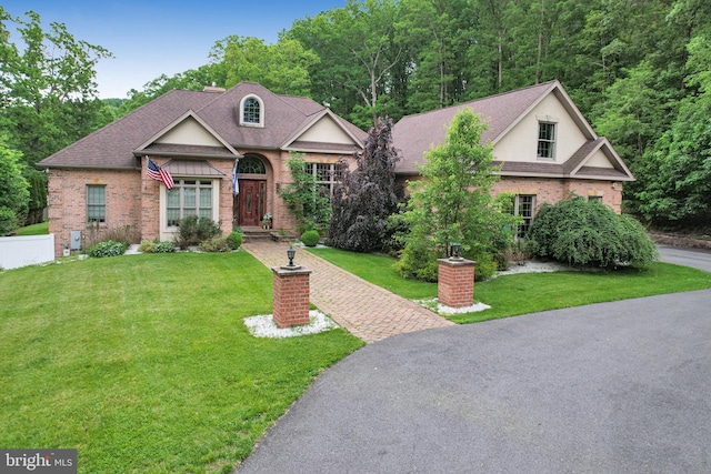 25 Mariner Ct, Ridgeley, WV 26753 - view of front of property featuring brick siding, a front yard, and a shingled roof