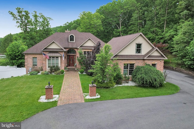 25 Mariner Ct, Ridgeley, WV 26753 - view of front of property featuring brick siding, driveway, a shingled roof, and a wooded view